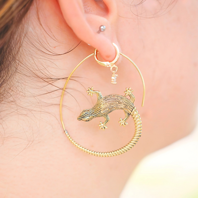 Gold lizard threader earrings with spiral hoop design for a bold look.