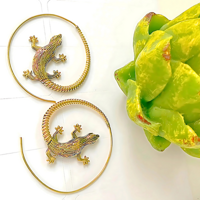 Bold and lightweight spiral hoop earrings featuring a playful lizard motif.