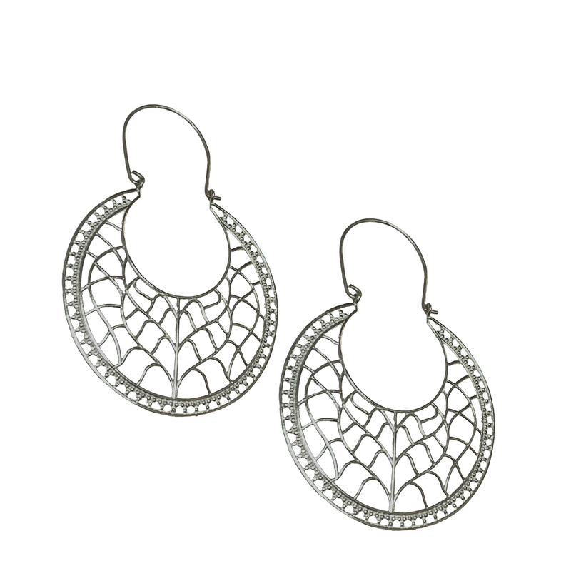 Pair of silver hoop earrings with intricate designs on a white background