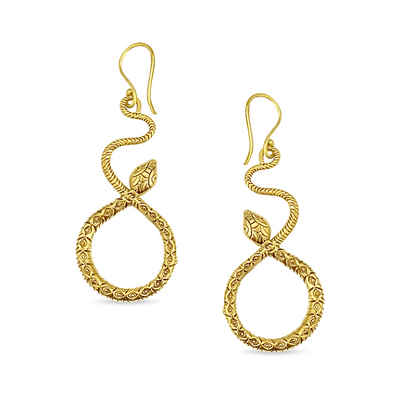 Close-up of gold snake dangle earrings with embossed texture, showcasing handcrafted detailing and artistic serpent-inspired elegance.