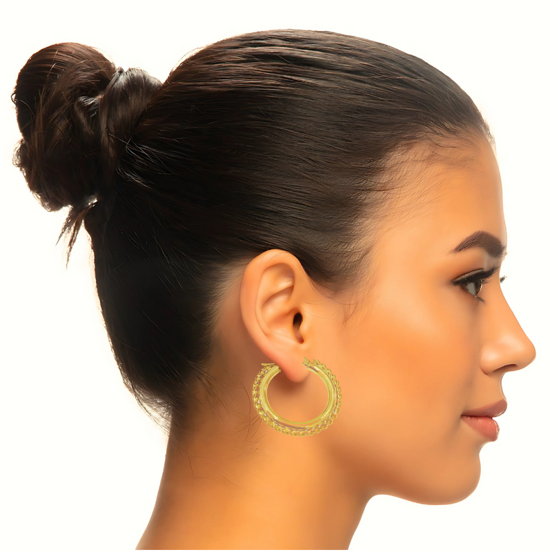 Classic gold hoop earrings with floral texture for a chic look.