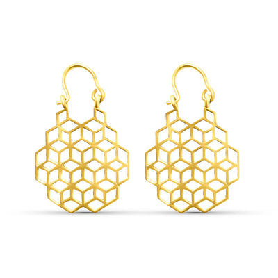 Minimal display of geometric honeycomb gold drop earrings, elegant statement jewelry.