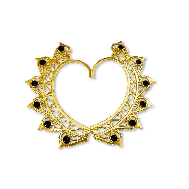 Front view of gold and gemstone heart ear cuff set featuring elegant black stone accents.