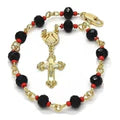 Close-up of gold cross and bead detailing on black and red rosary bracelet.