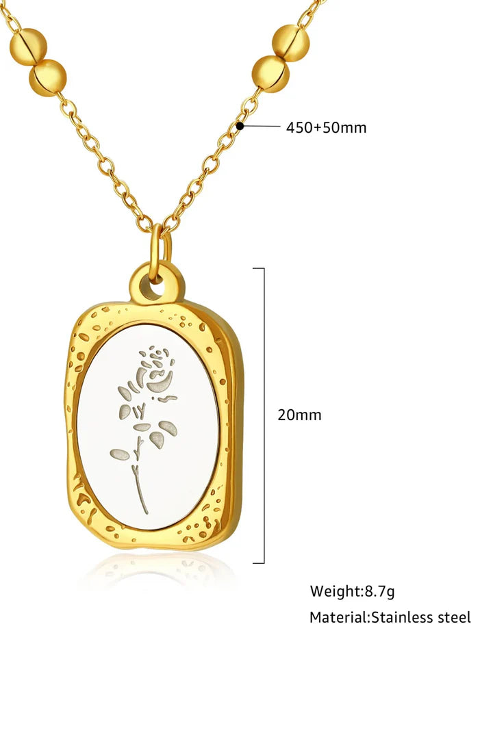 Gold enamel floral pendant necklace showing pendant size and chain length, made from stainless steel with elegant floral engraving.