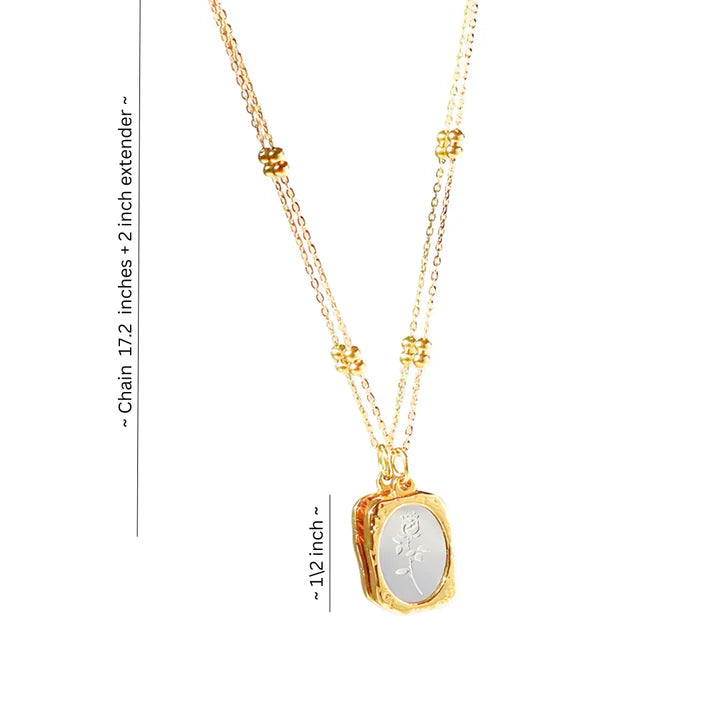 Gold enamel floral pendant necklace showing size dimensions, minimalist charm jewelry.