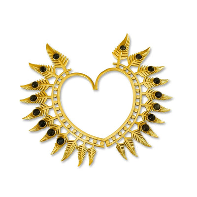 Gold heart-shaped ear cuff set with radiant sunburst gemstone design.