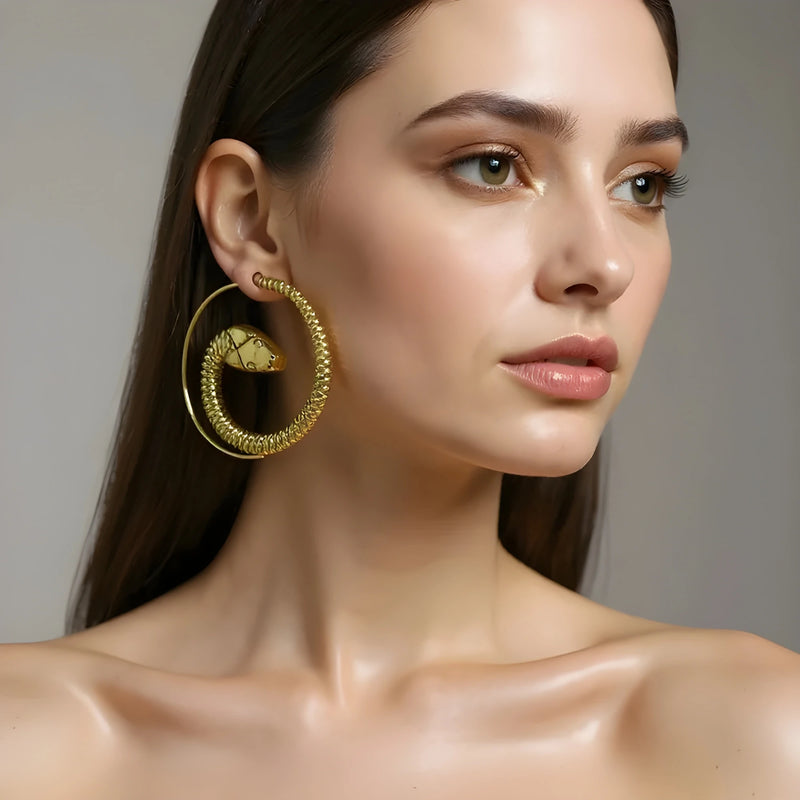 Model wearing gold snake threader earrings, 1.5-inch minimalist drop design. 