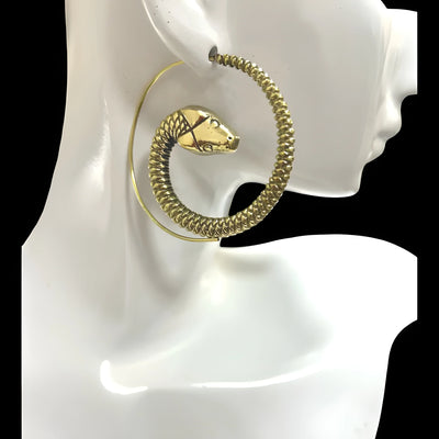 Gold snake threader earrings on mannequin stand, modern minimalist style.
