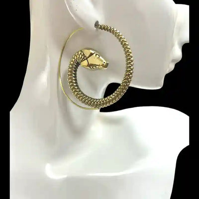 Gold snake threader earrings on mannequin stand, modern minimalist style.