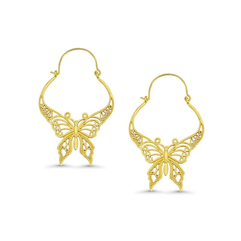 Pair of golden butterfly hoop earrings displayed on white surface, lightweight feminine accessory.