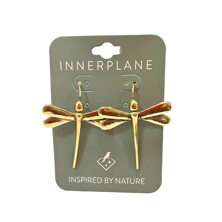 Golden dragonfly earrings displayed on branded card packaging, handcrafted artistic jewelry.