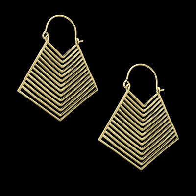 Golden geometric earrings displayed on dark background, contemporary statement jewelry.