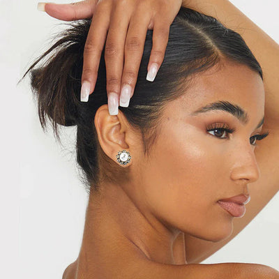 Model wearing Pearl and Diamond Cluster Stud Earrings for a classic elegant look.