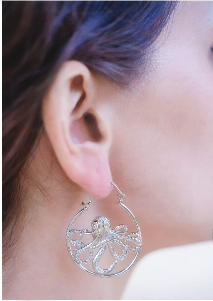 Model wearing silver-tone Kraken ocean octopus drop earrings for an ocean-inspired bold look.