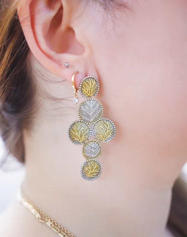 Model wearing Two Tone Gold and Silver Leaf Drop Earrings in elegant style.