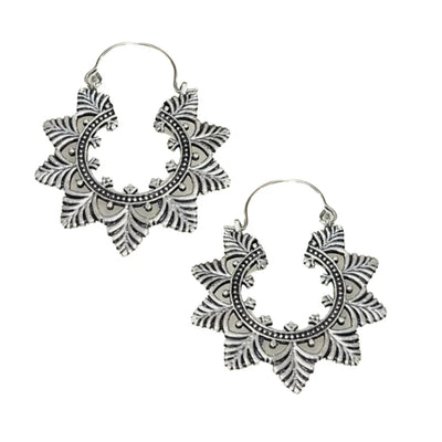 Pair of silver Evergreen Creole Leaf hoop earrings photographed from a side view.