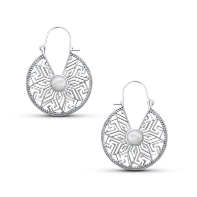 Pair of sterling silver mandala flower hoop earrings featuring intricate geometric design and cat eye stone.