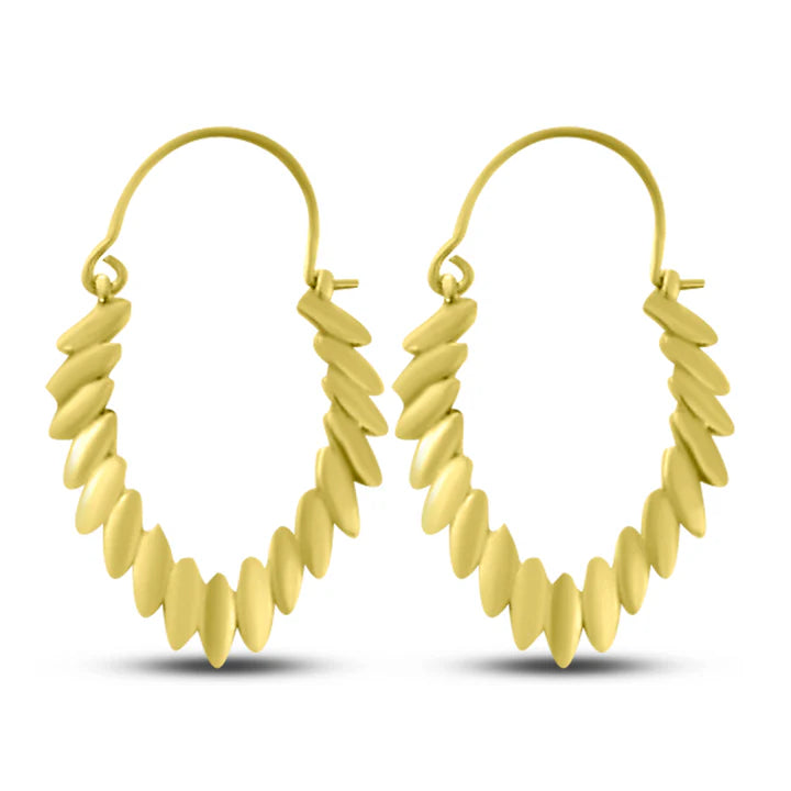 Pair of gold-plated tribal leaf hoop earrings displayed on white background.