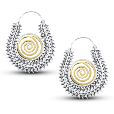 Pair of Warli design handcrafted hoop earrings showing detailed spiral pattern in silver and gold tone.