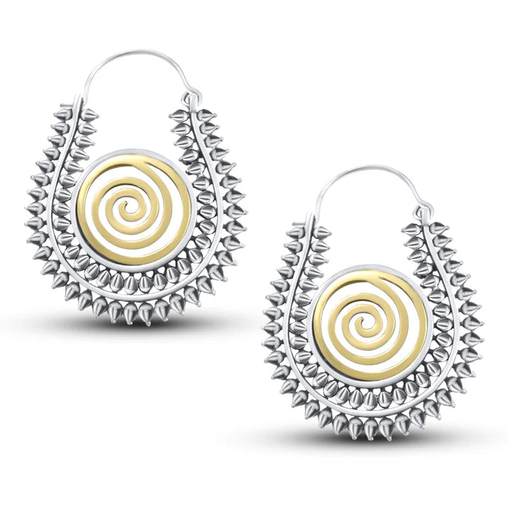 Pair of Warli design handcrafted hoop earrings showing detailed spiral pattern in silver and gold tone.