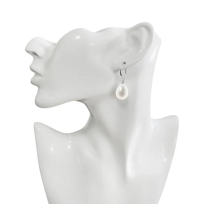 Silver plated pearl earrings displayed on mannequin stand.