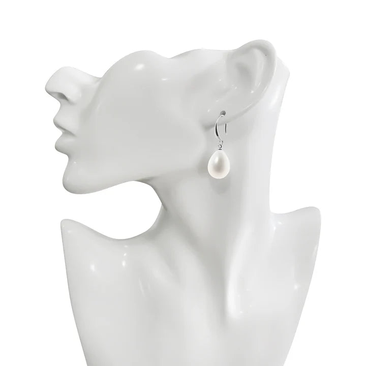 Silver plated pearl earrings displayed on mannequin stand.