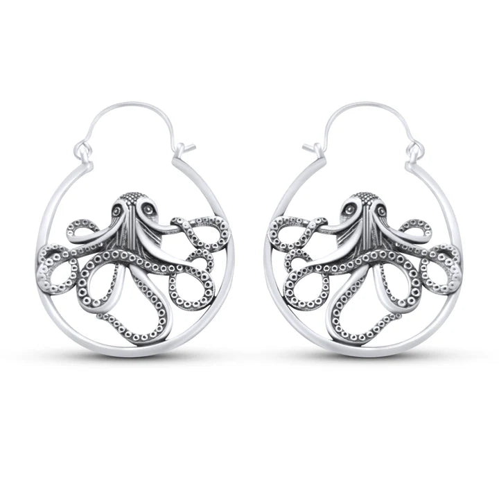 Close-up of single gold Kraken ocean octopus earring highlighting intricate metal texture.