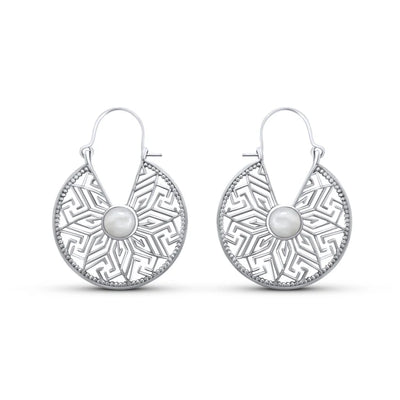 Front view of sterling silver mandala flower hoop earrings with white cat eye stone centerpiece.