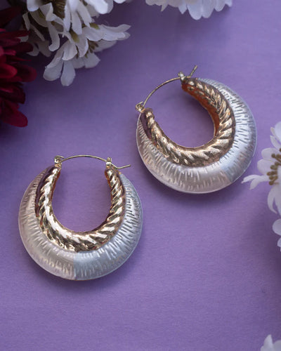 Tricolor Gold Plated Medium Classic Basket Hoop Earrings on purple background with floral decor.