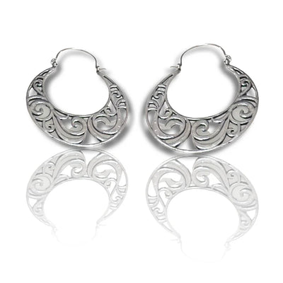 Front view of vintage curvy hoop gold and silver boho earrings with elegant swirl detailing.