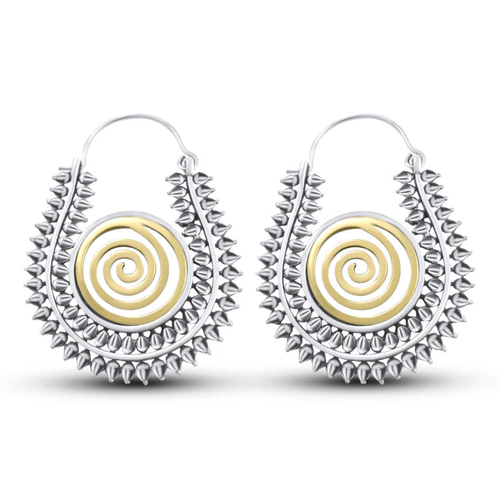 Front view of Warli design silver gold tone spiral handcrafted hoop earrings with dual finish.